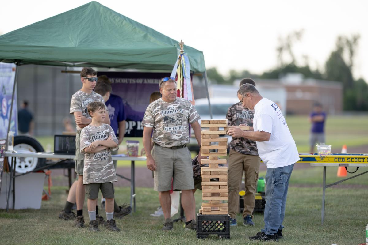 Man playing giant Jenga game courtesy of New Egypt Boy Scouts Troop 9