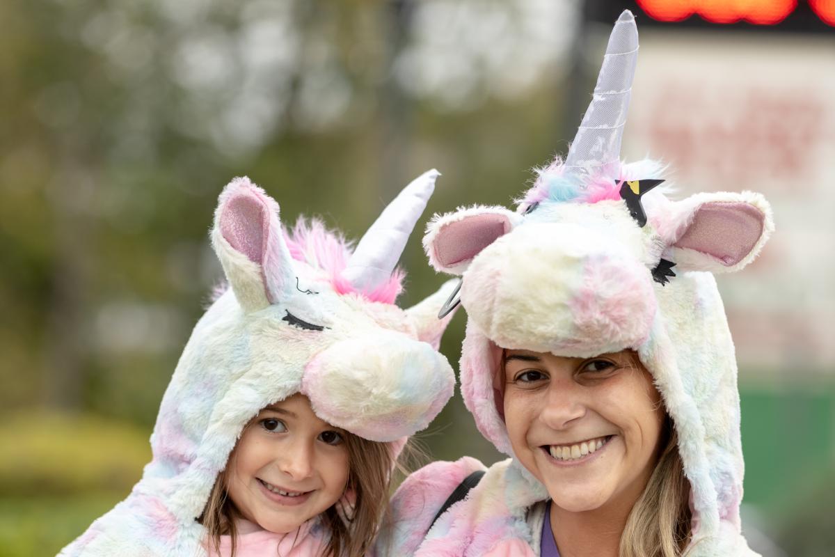 Woman and girl in unicorn costumes